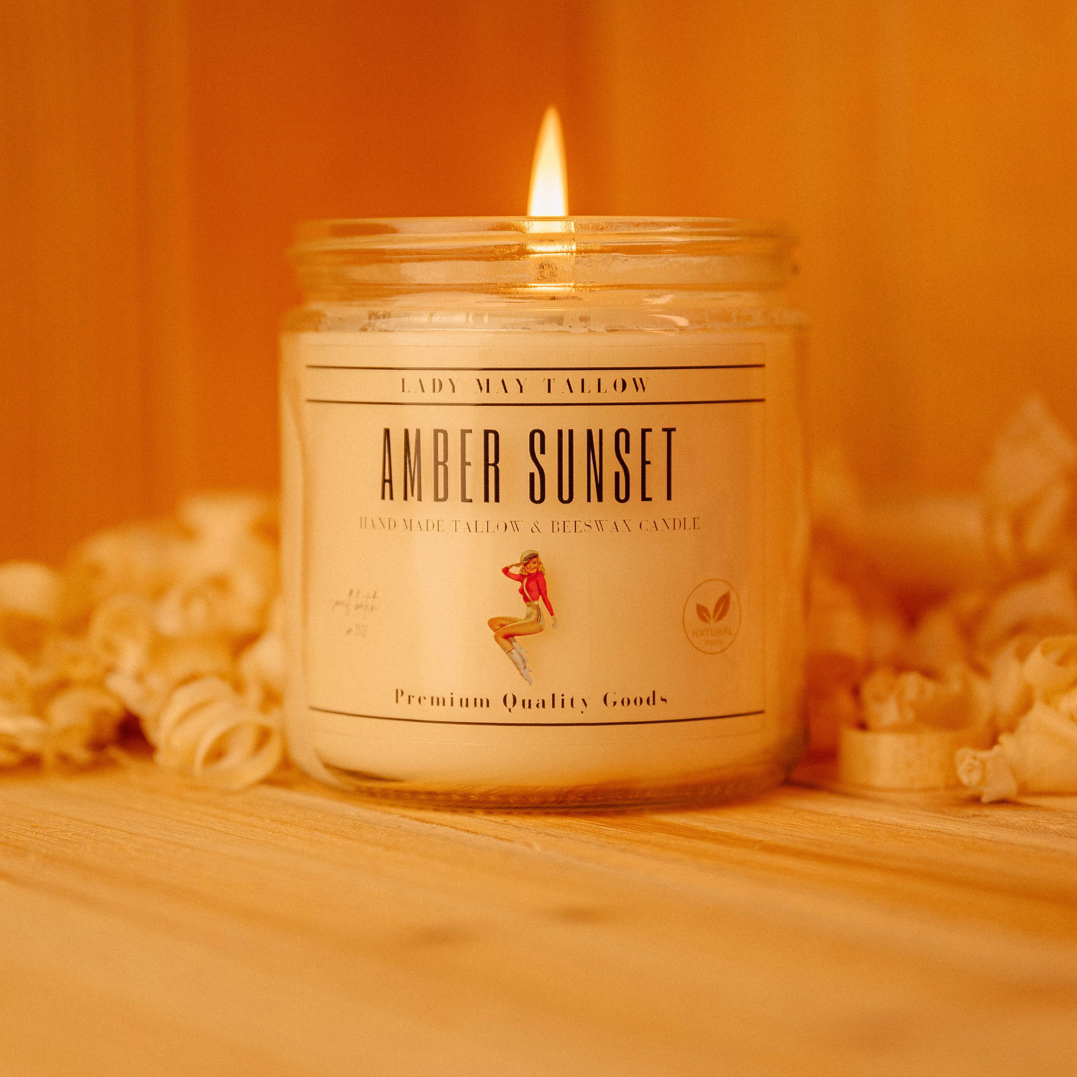 Seasonal Tallow & Beeswax Candle 16oz | Non Toxic Grass-Fed All-Natural Clean Burning Amber Sunset jar candle lit on wooden table